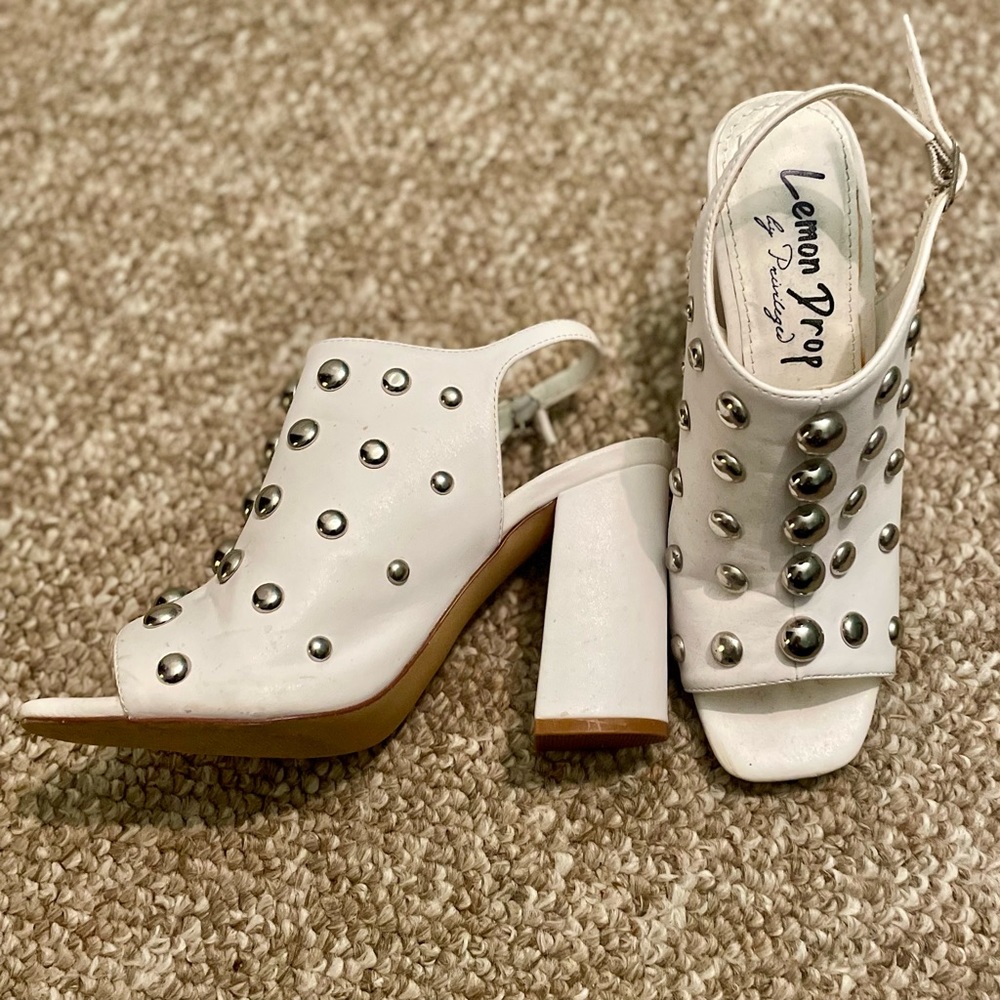 Barely worn white heel with studding details; 3”